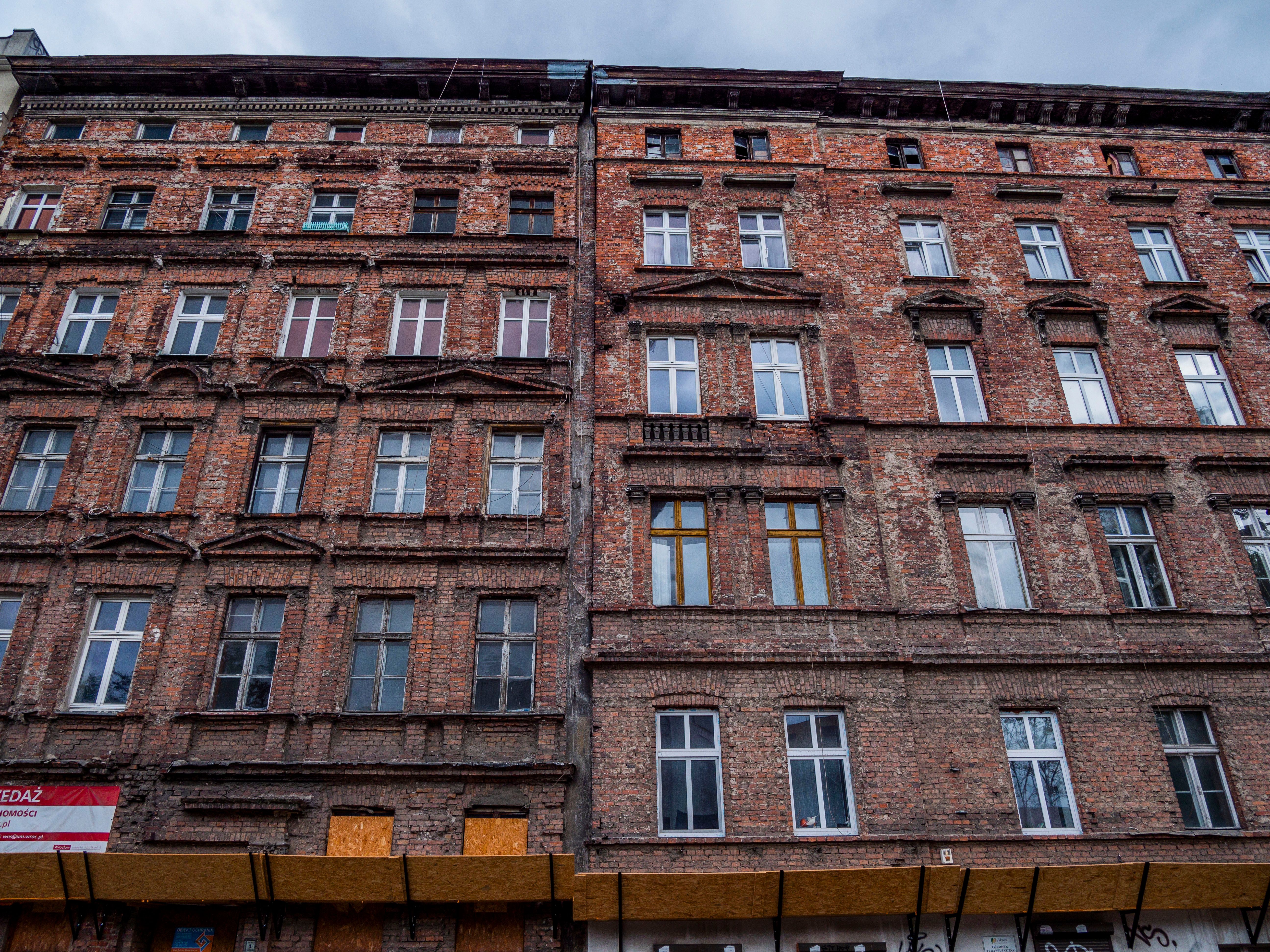 Old Brick Building Facade with Windows · Free Stock Photo