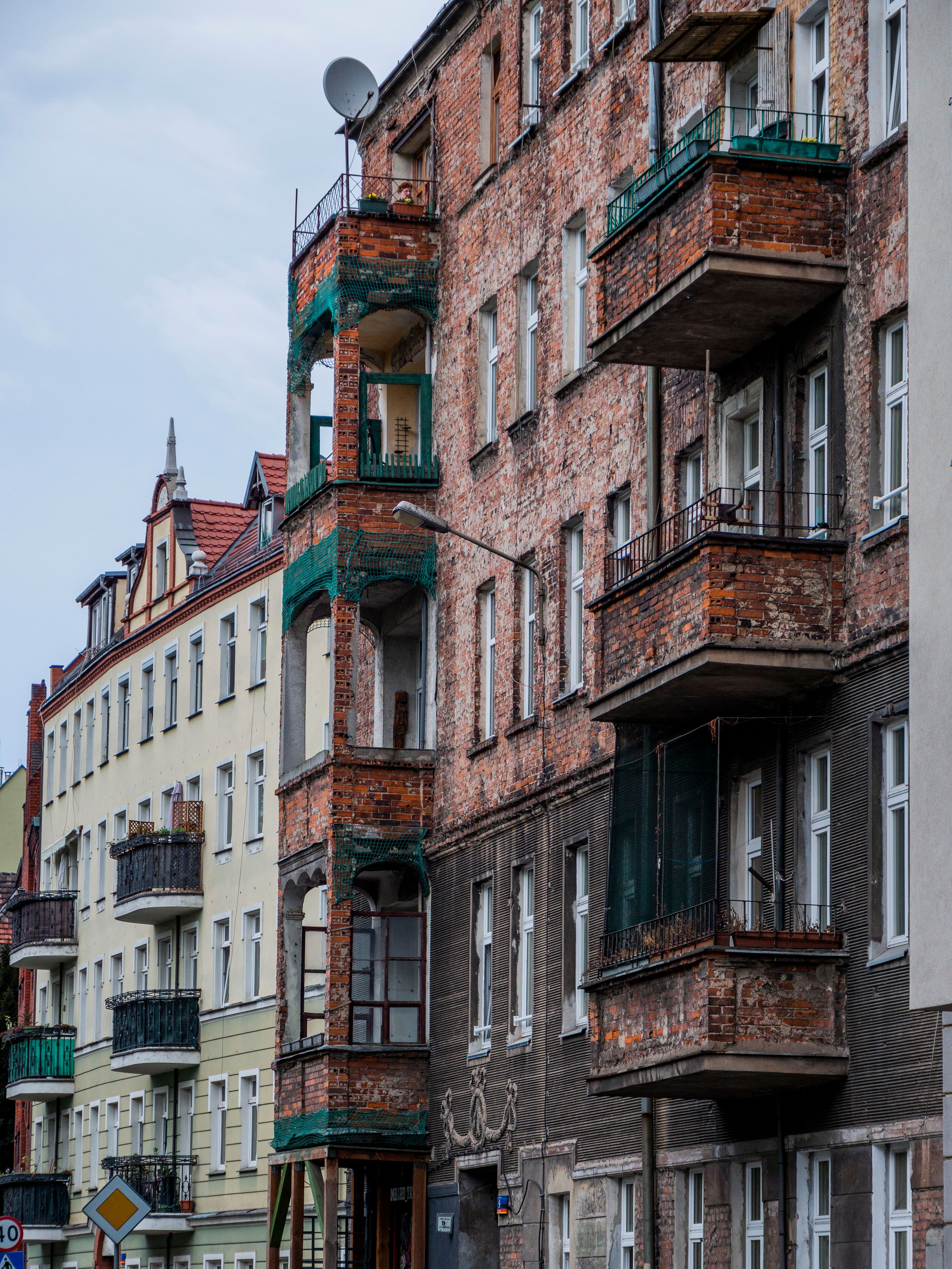 Image showcasing Historic Urban Apartments with Brick Facades · Free Stock Photo