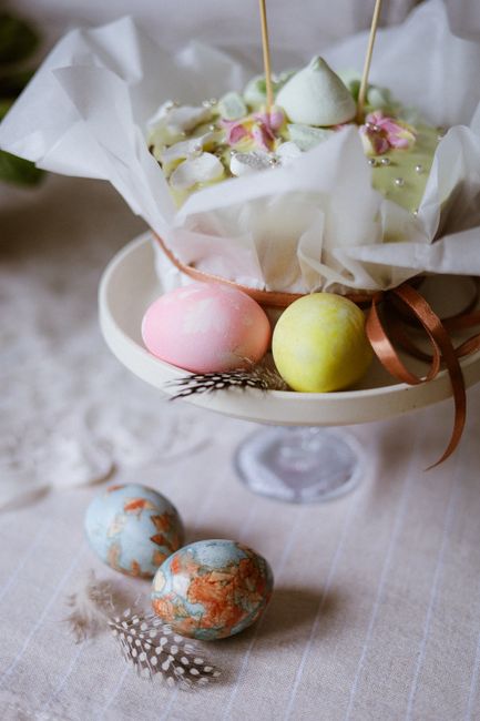 Colorful Easter eggs and a whimsical cake create a festive holiday display.