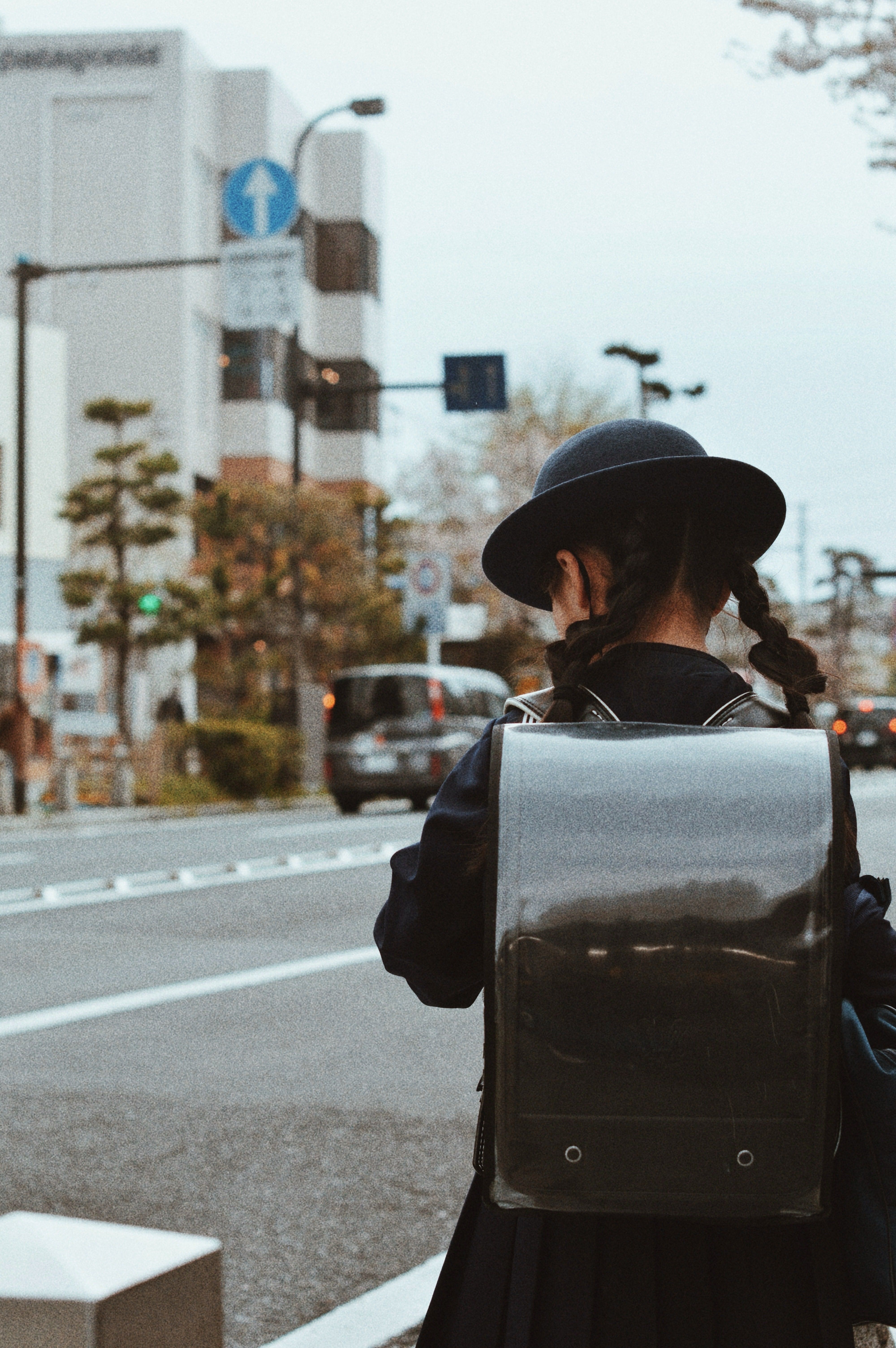 Young Student Walking in City Street with Backpack · Free Stock Photo