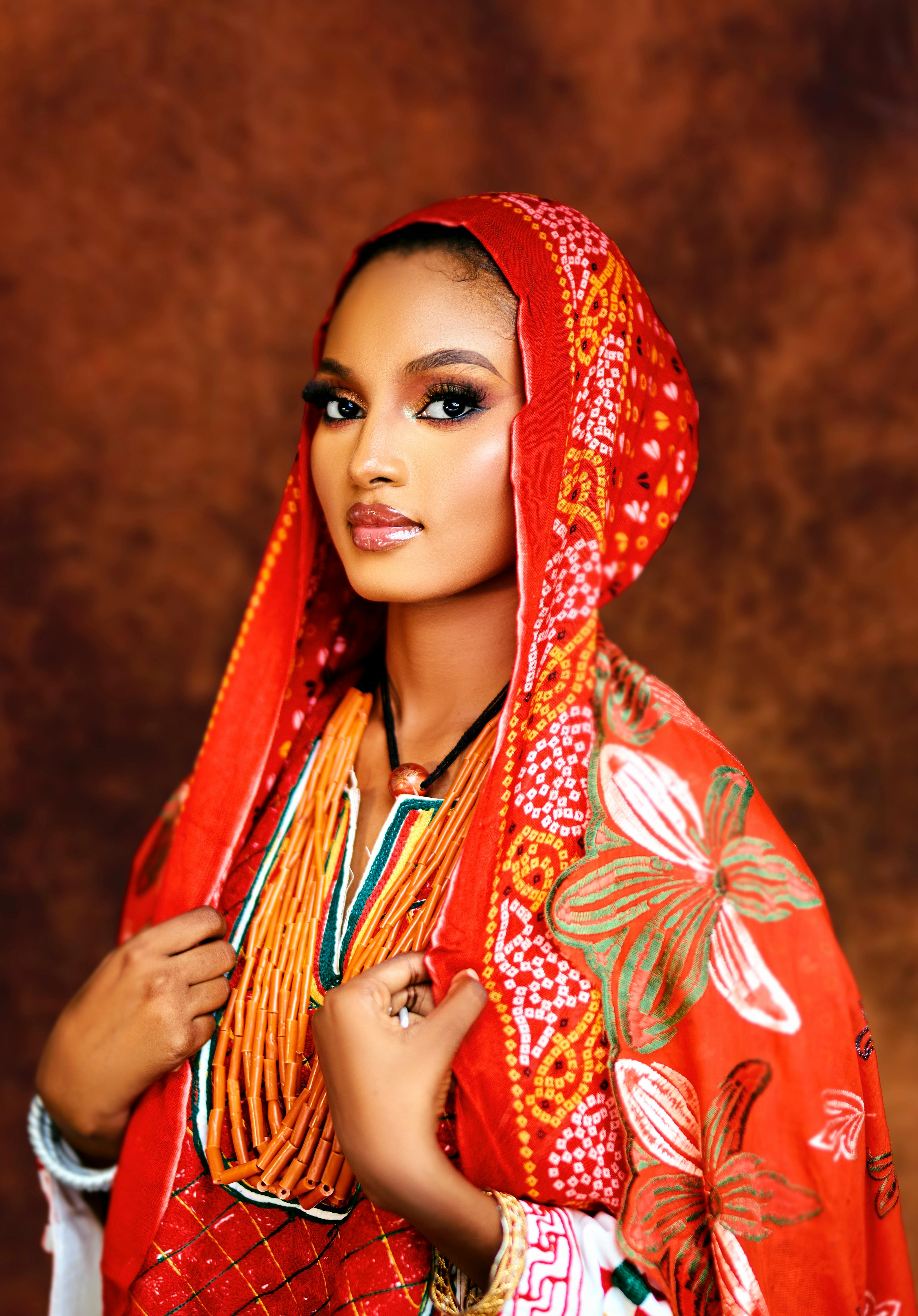 Elegant portrait of a woman wearing colorful traditional attire, rich in cultural detail.