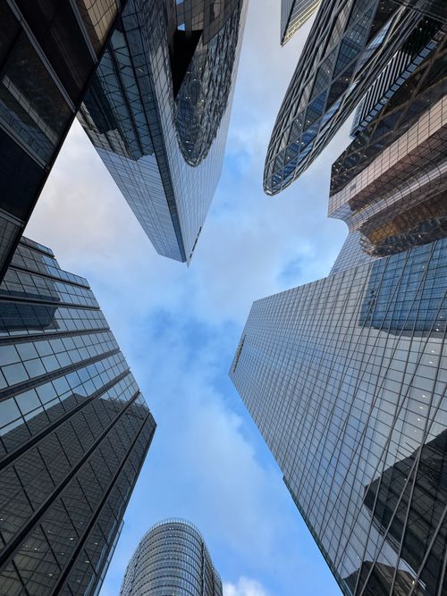 Free Upward view of modern skyscrapers in La Défense, Paris, reflecting a vibrant urban atmosphere. Stock Photo