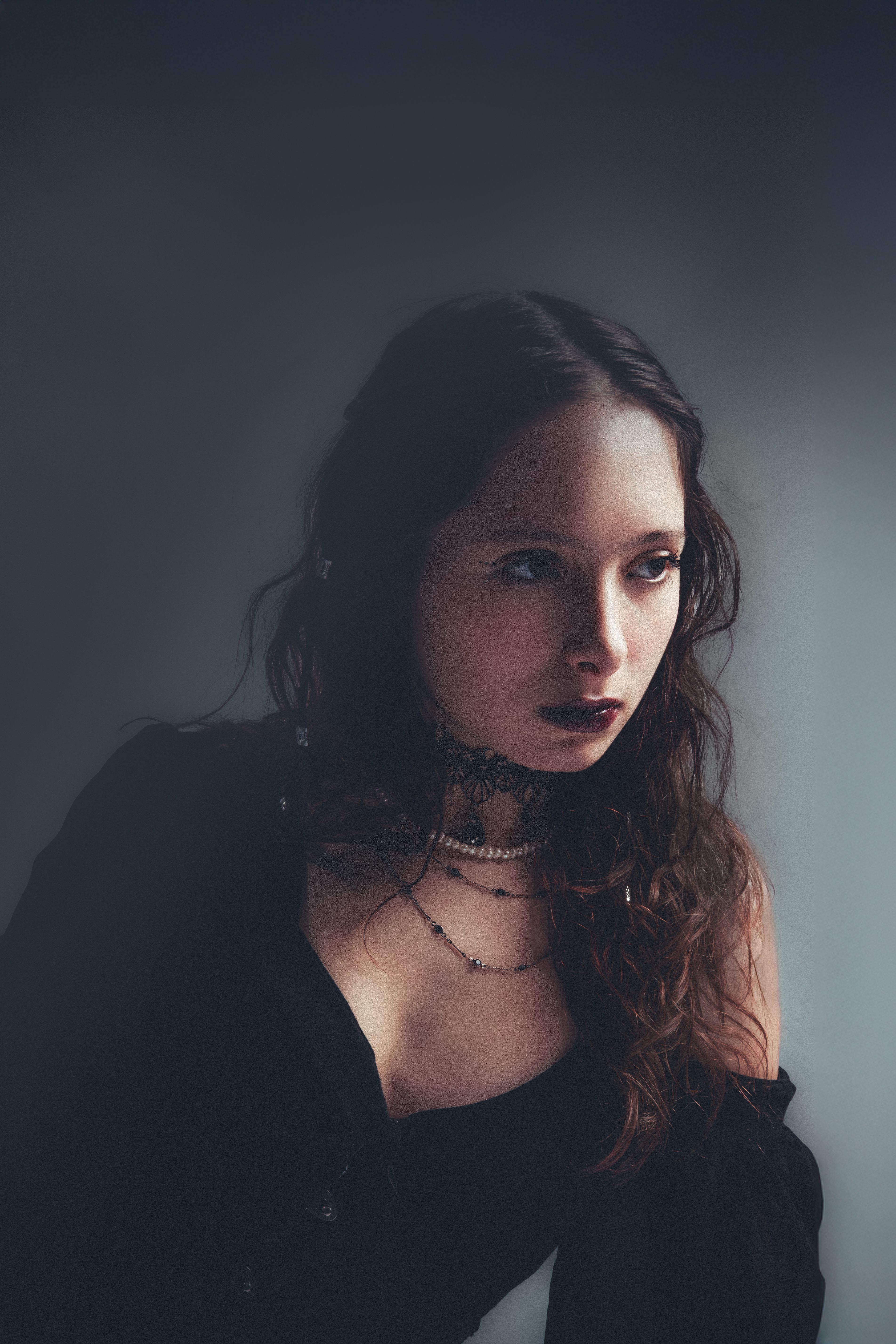 Moody Portrait of a Woman in Soft Light · Free Stock Photo