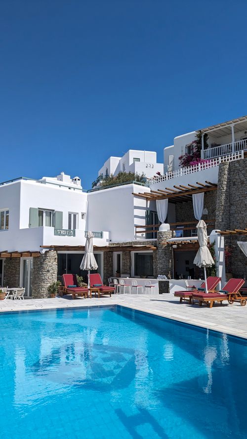 Free Stunning view of a luxury hotel with a pool in Mykonos, Greece. Ideal for travel enthusiasts. Stock Photo