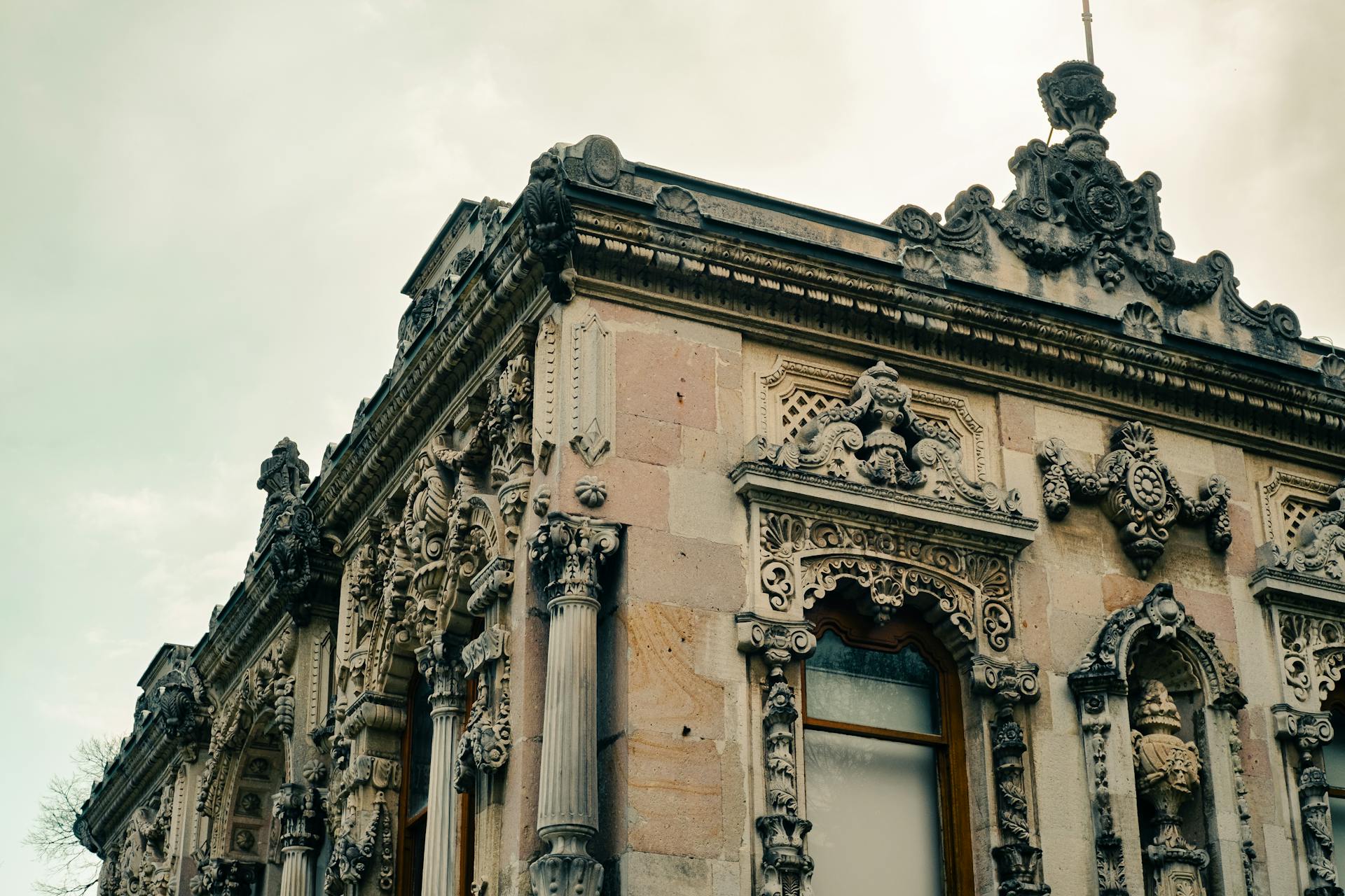 Detailed view of an ornately decorated historical building facade with intricate carvings and designs.