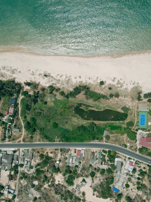 Free Aerial view capturing the scenic coastline and landscape of La Gi, Bình Thuận province, Vietnam. Stock Photo