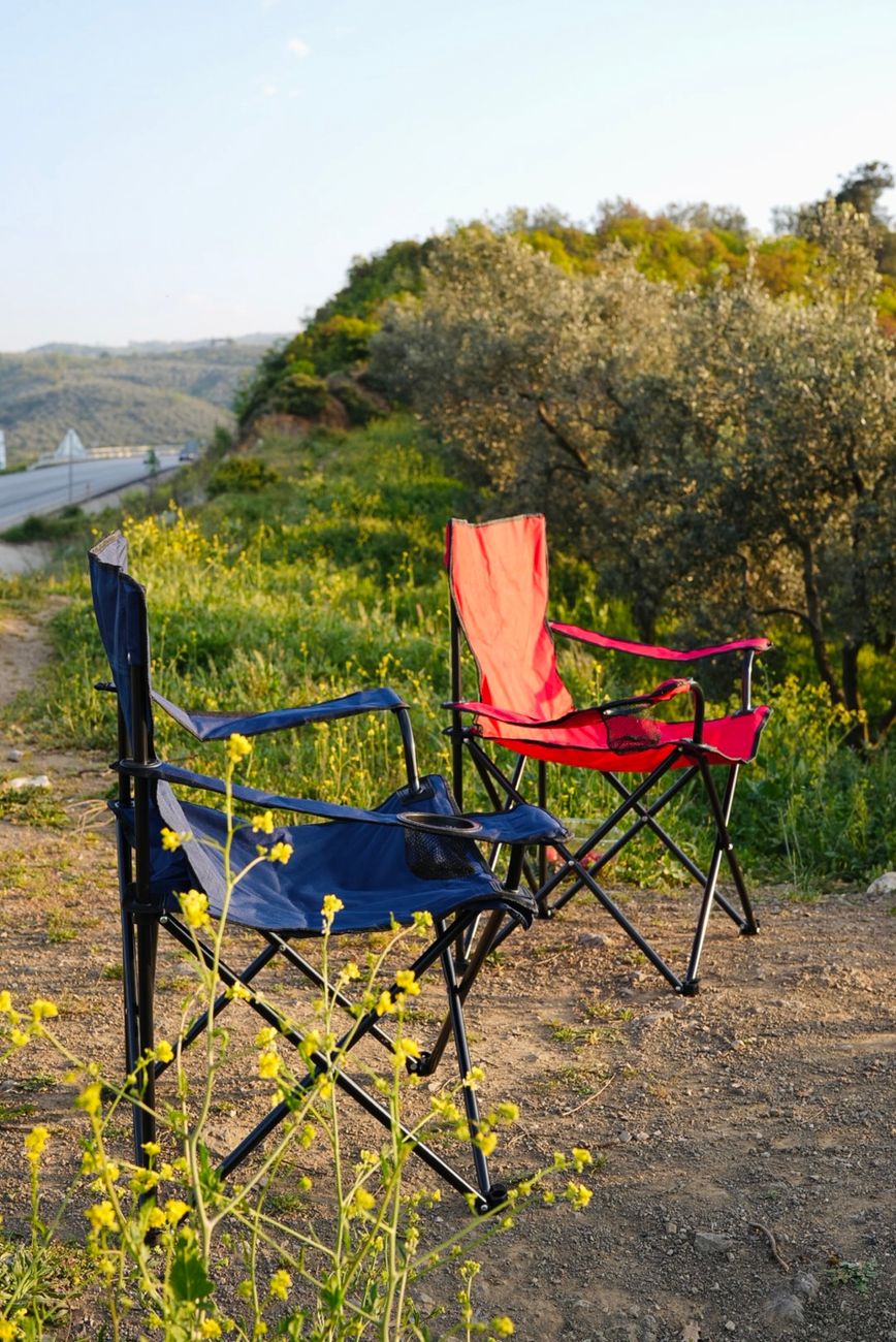 Two camping chairs sitting ready in the open, which is the moment when seat height and easy exit start to matter more than brochure fluff.