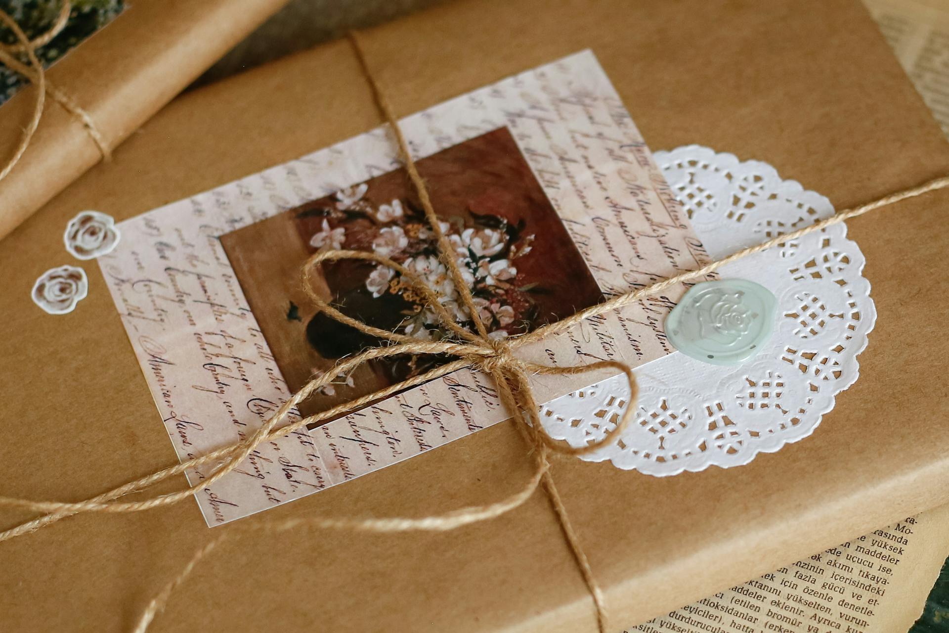 Beautifully wrapped gift with vintage elements, twine, and wax seal enhancing its charm.