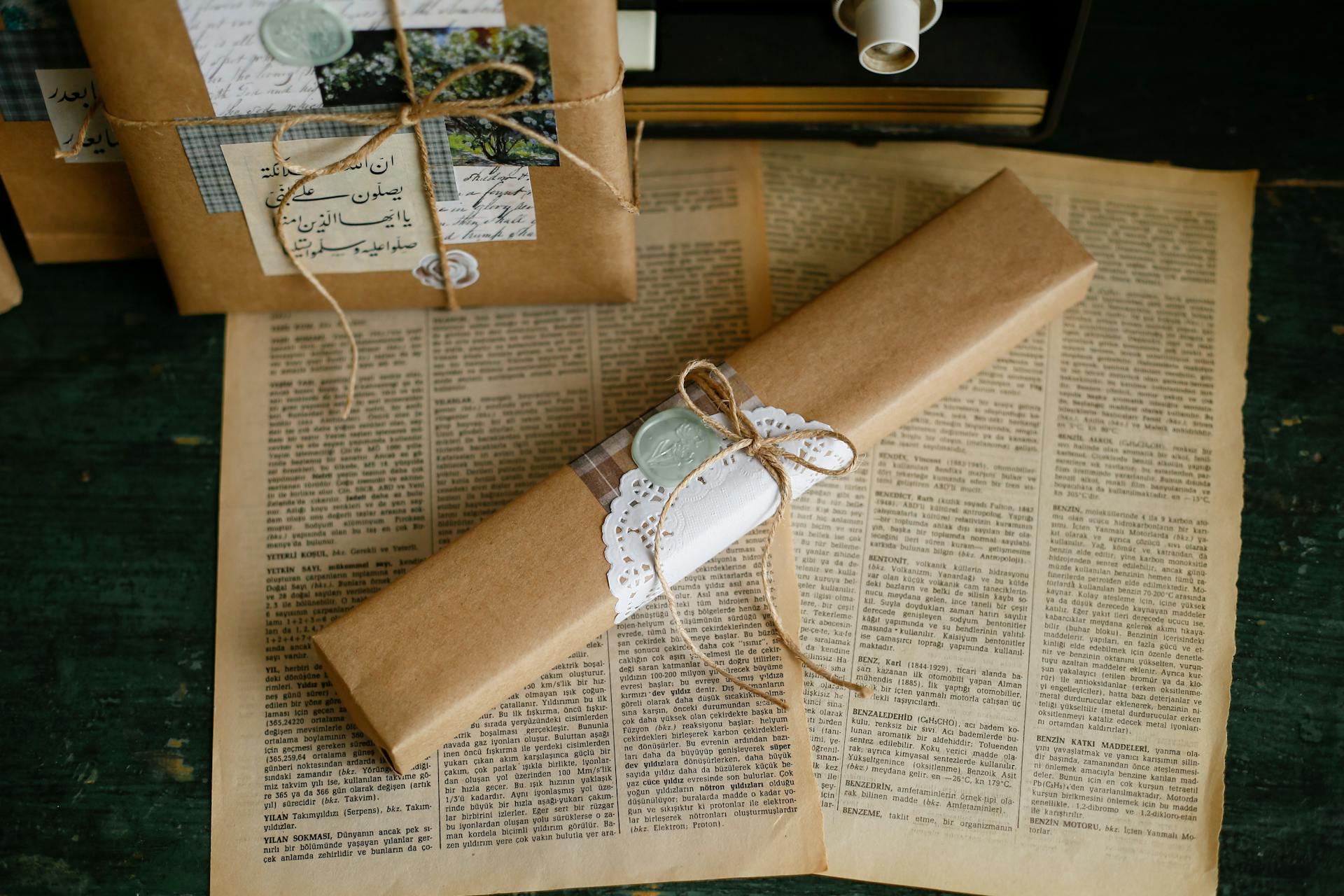 Aesthetic vintage gift wrapping with brown paper and lace on antique book pages.