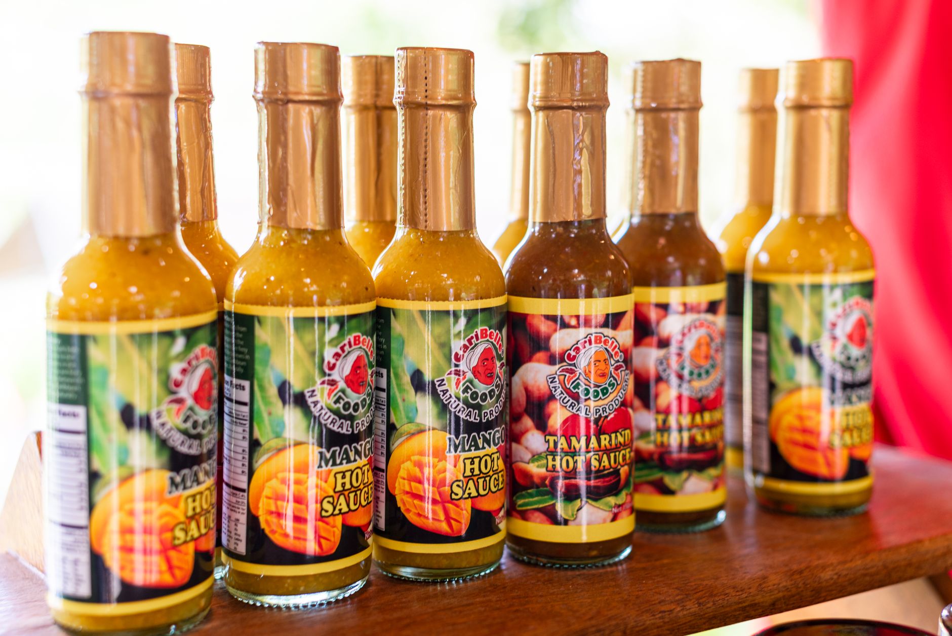 Torchbearer Garlic Reaper Hot Sauce with fresh garlic cloves