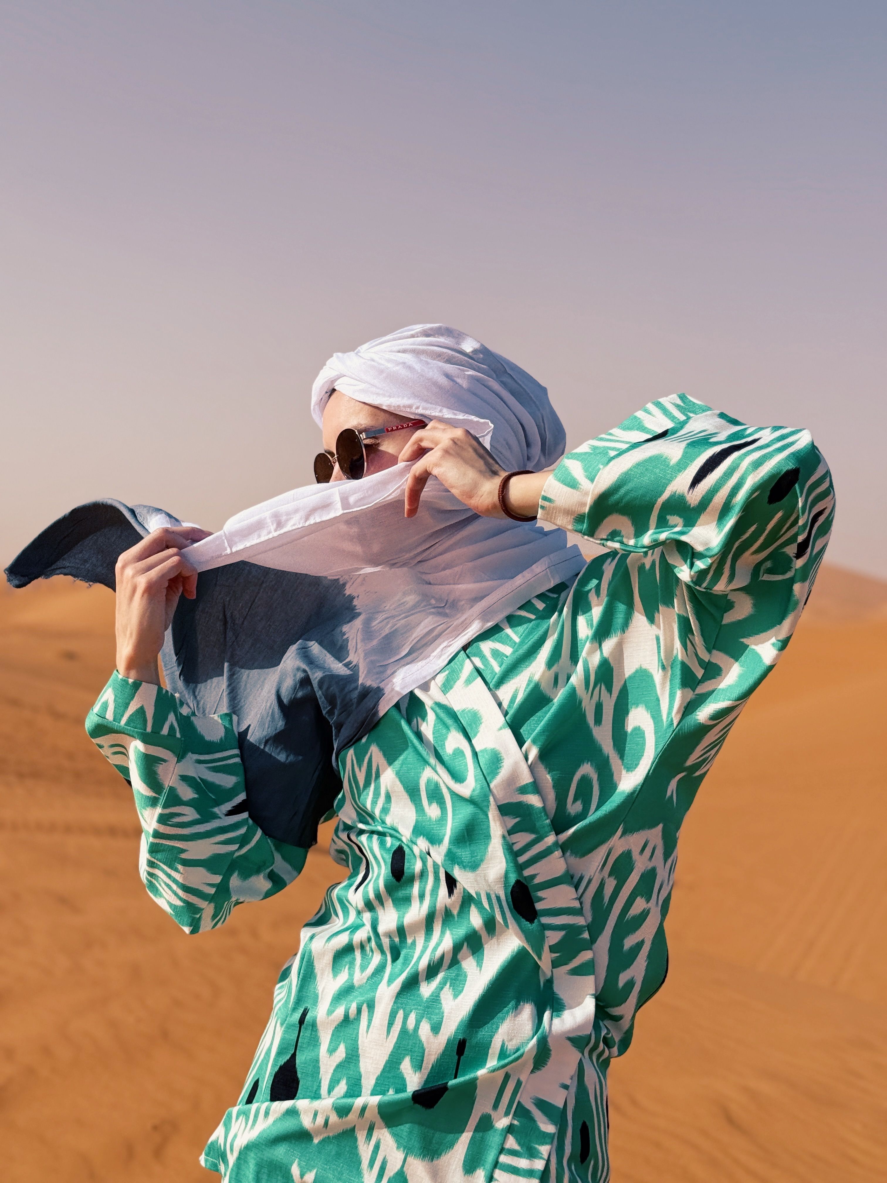 Woman in Colorful Attire in Desert Landscape · Free Stock Photo
