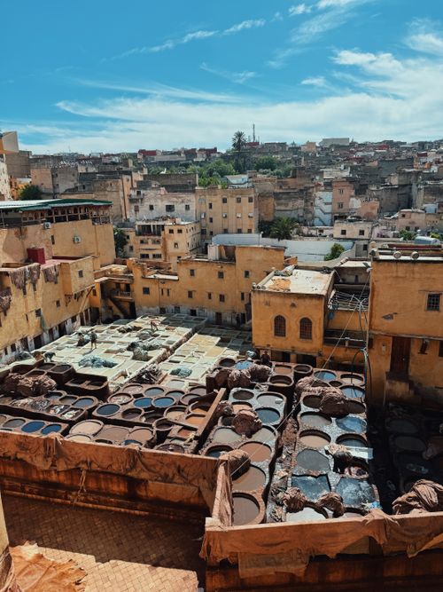 Free Explore the vibrant tannery in Fez, Morocco, showcasing traditional dyeing methods from above. Stock Photo