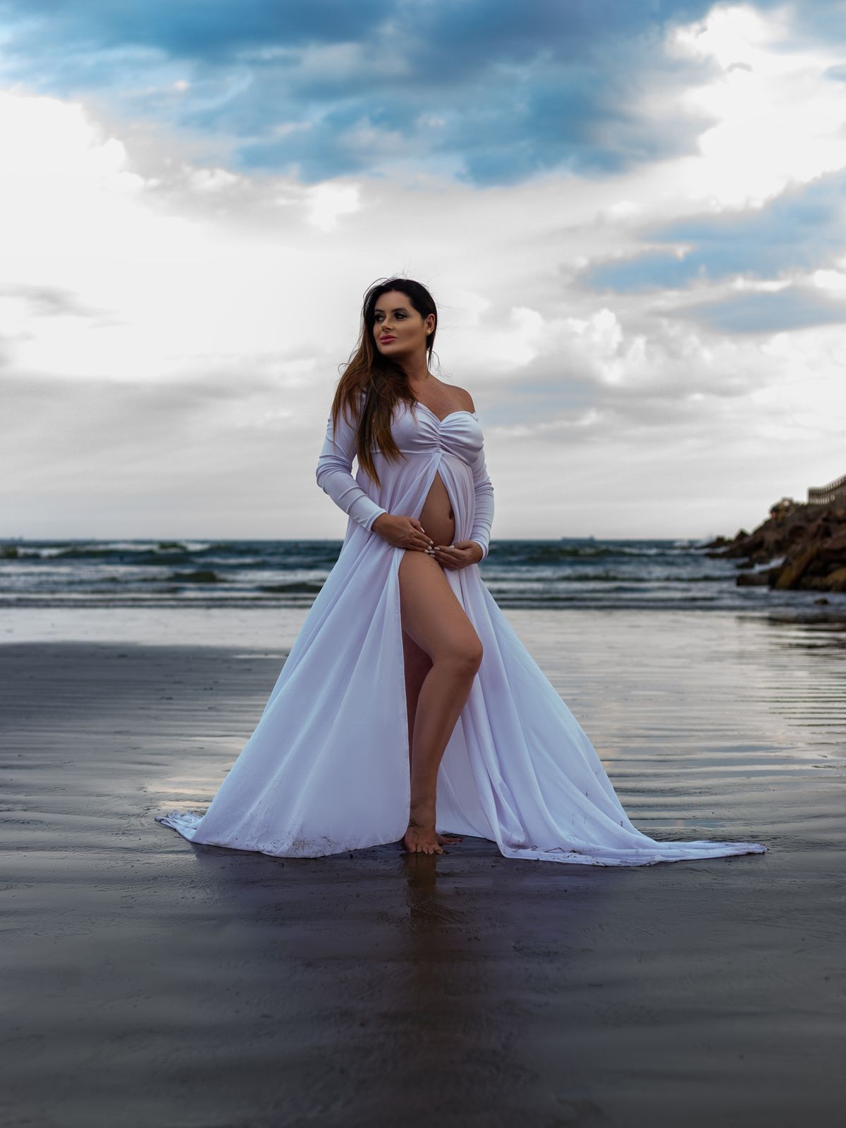 pregnancy announcement photoshoot dress Melbourne — pregnant woman white dress beach reveal Craigieburn northern suburbs VIC