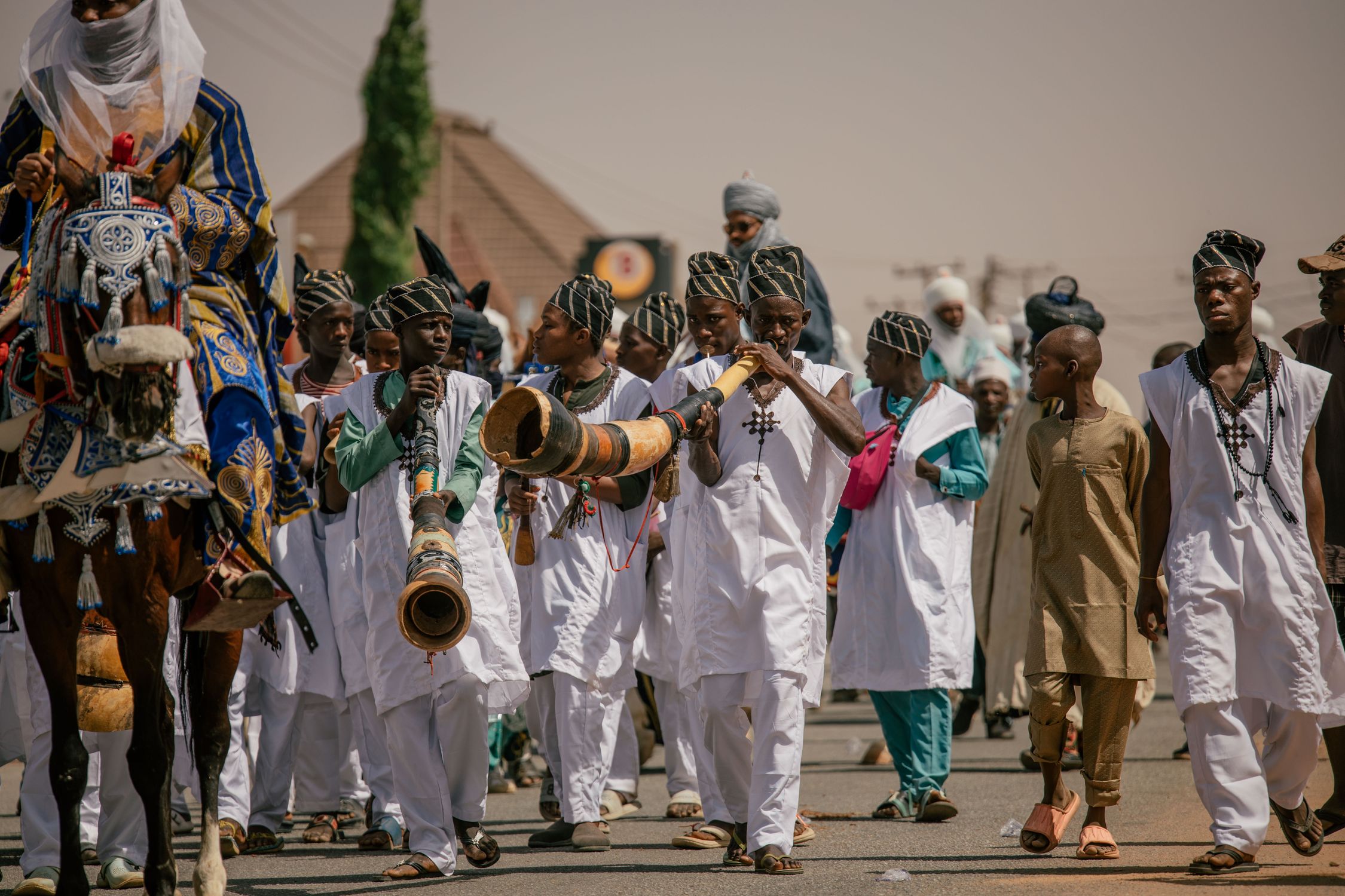 Nigerian Insteuments Traditional Nigerian Parade with Musical Instruments · Free Stock Photo