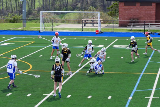 Vibrant image of young athletes playing lacrosse on a sunny day outdoors.