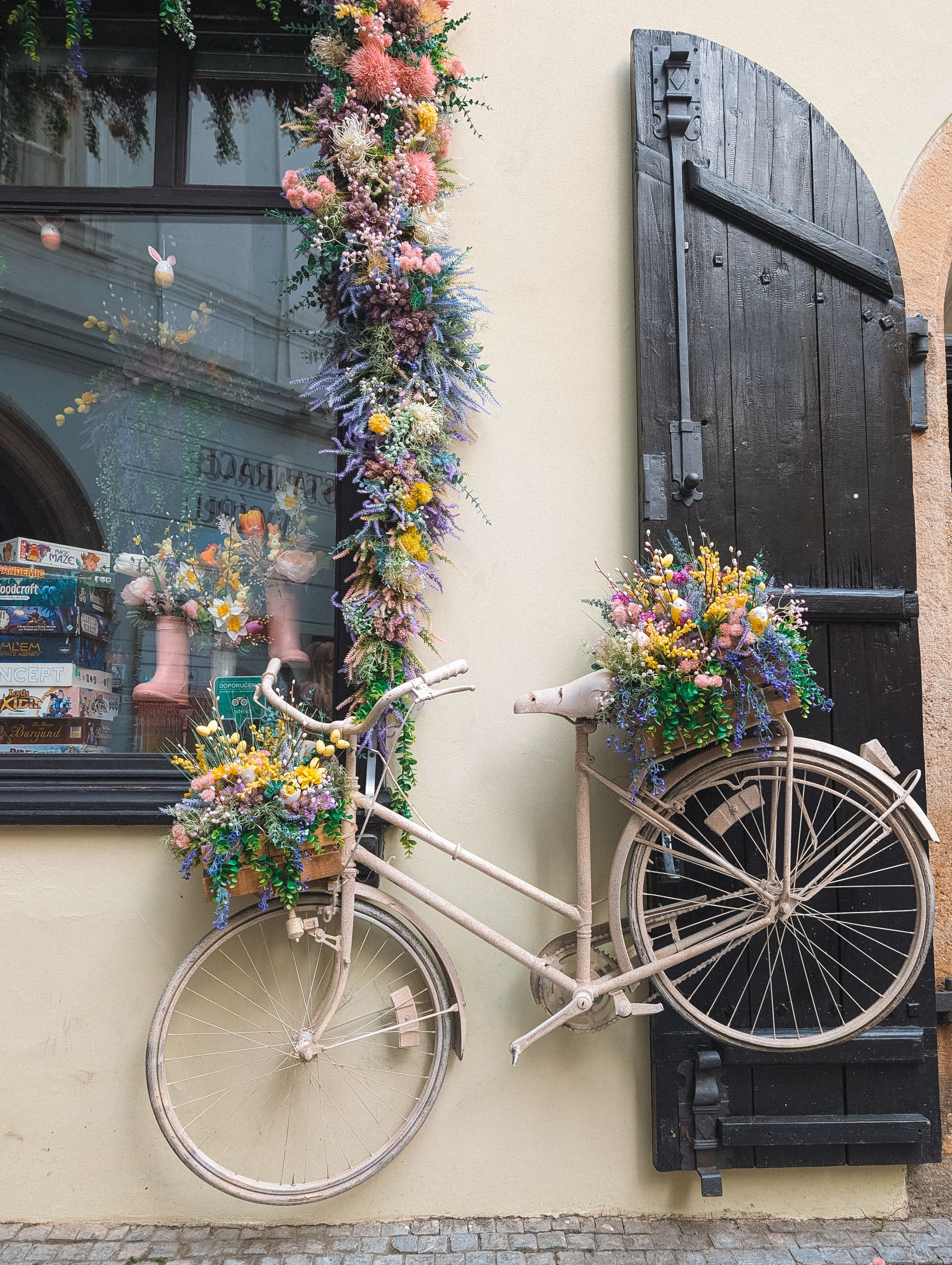 Vintage Bicycle with Floral Display in Prague · Free Stock Photo