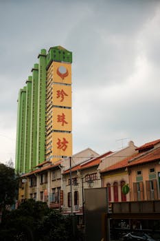 Glimpse the contrast of traditional and modern architecture in a vibrant Chinatown setting.