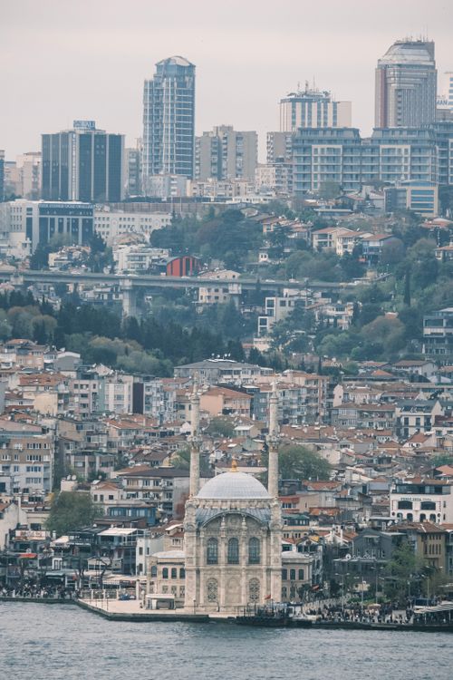 Free Aerial view of the iconic Ortaköy Mosque with Istanbul's cityscape in the background. Stock Photo