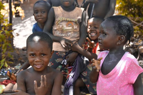 Free A group of joyful African children playing outdoors in Monrovia, Liberia on a sunny day. Stock Photo