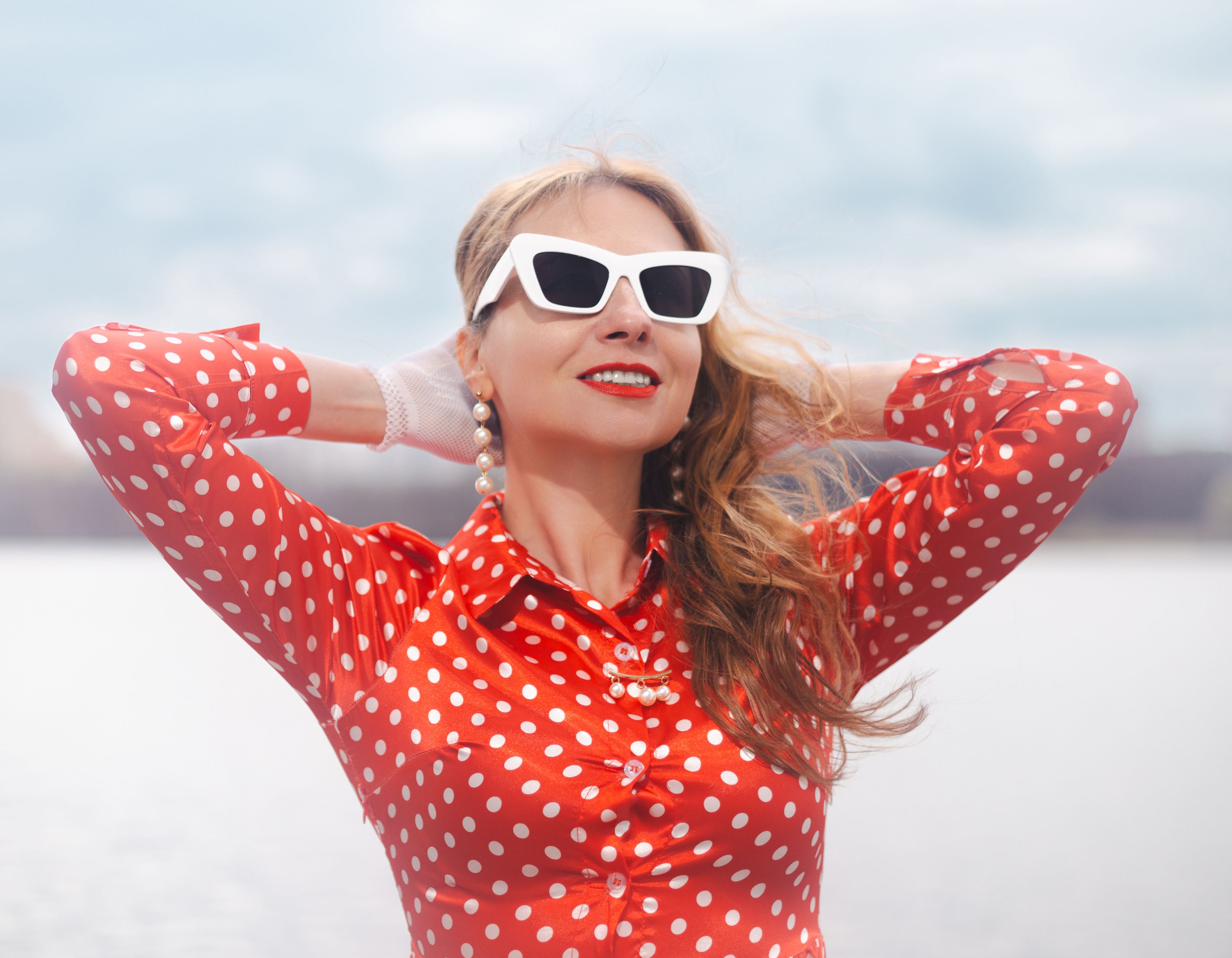 Woman in Polka Dot Dress Enjoying Outdoors · Free Stock Photo