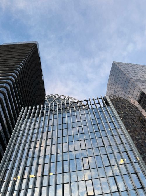 Free Upward view of modern skyscrapers in La Défense, showcasing contemporary architecture. Stock Photo