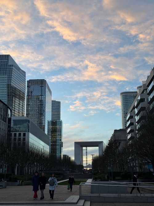 Free Stunning view of La Défense skyscrapers under colorful sunset skies in Paris, France. Stock Photo