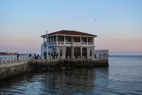 Free Moda Pier in Istanbul at sunset, overlooking calm waters and the skyline. Stock Photo