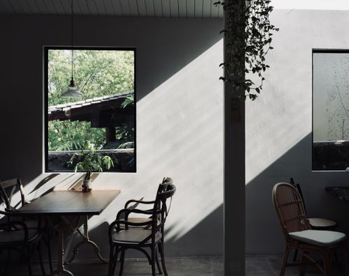Free A tranquil cafe interior in Huzhou, Zhejiang with soft natural light and wooden furniture. Stock Photo