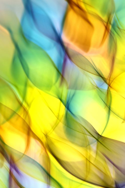 Free Vibrant abstract swirling light patterns in a dynamic and colorful design. Stock Photo