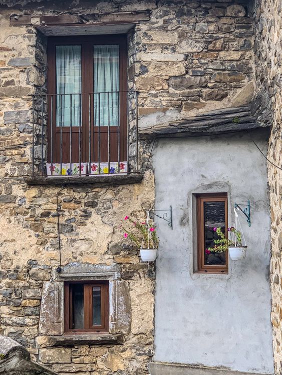 Charming Rustic Stone House Facade with Windows · Free Stock Photo