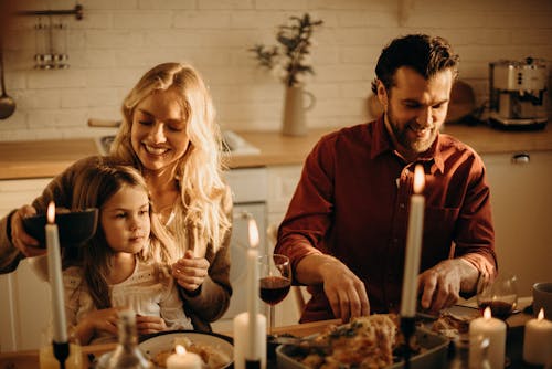 Free Family Having Meal at the Table Stock Photo