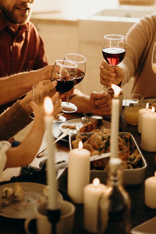 Free People Holding Wine Glasses Stock Photo