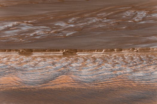 A mesmerizing abstract aerial view of sandy patterns on Guaratuba Beach, Paraná, Brazil.
