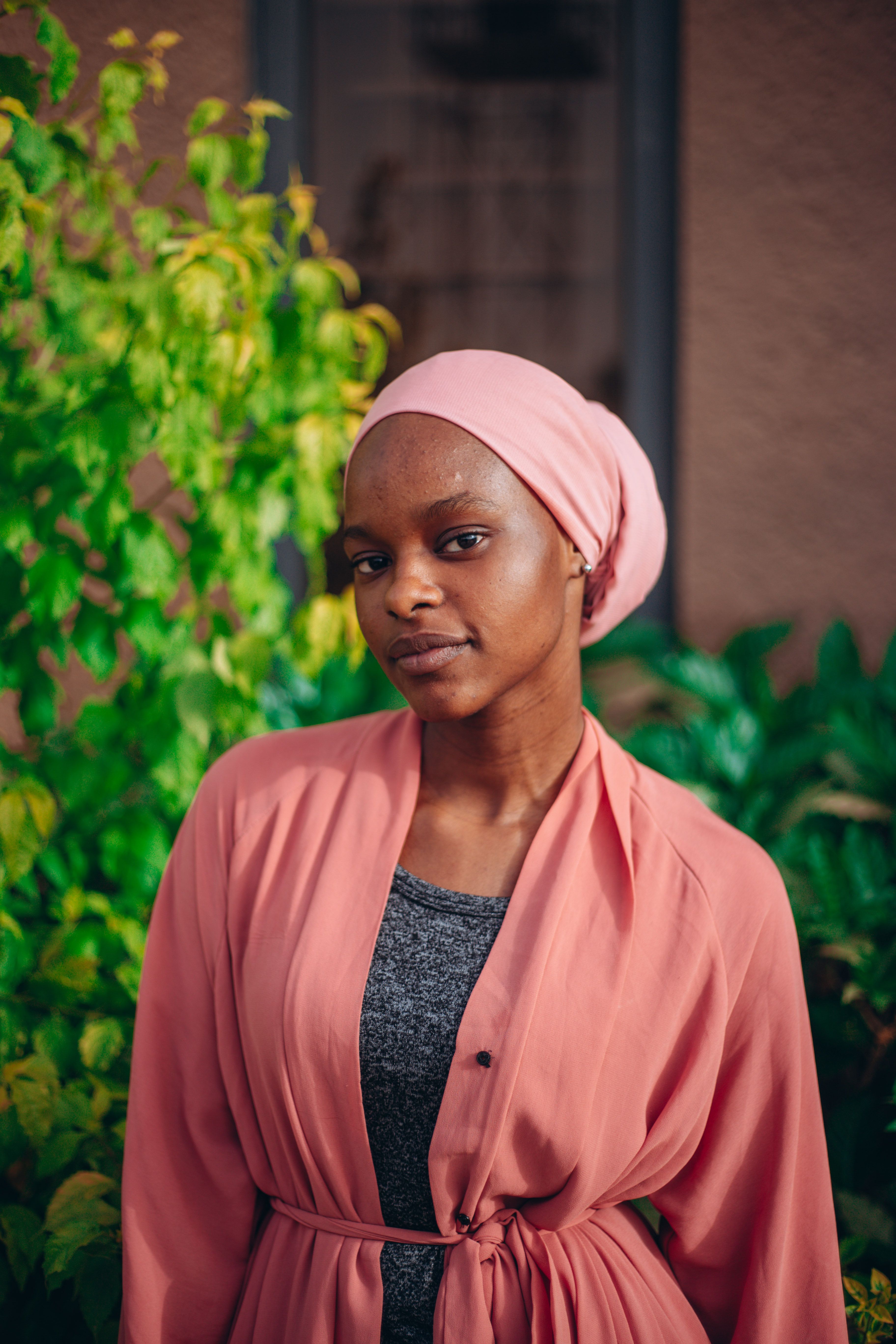 Portrait of a Woman with Pink Headscarf Outdoors · Free Stock Photo