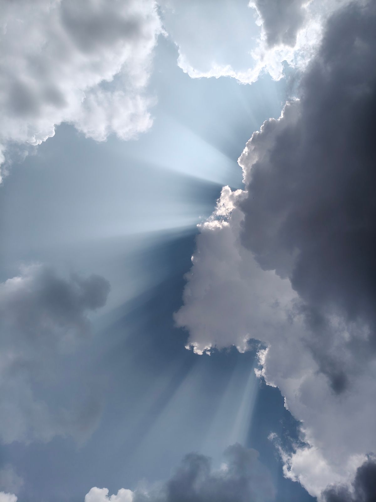 Dramatic Sun Rays Breaking Through Storm Clouds · Free Stock Photo