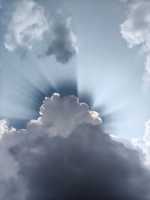 Free Majestic sunrays piercing through clouds in Silchar, Assam, India, creating a dramatic scene. Stock Photo