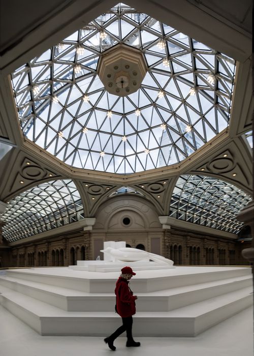 Free A striking indoor view of a modern atrium in Buenos Aires with intricate architecture and a person in red. Stock Photo