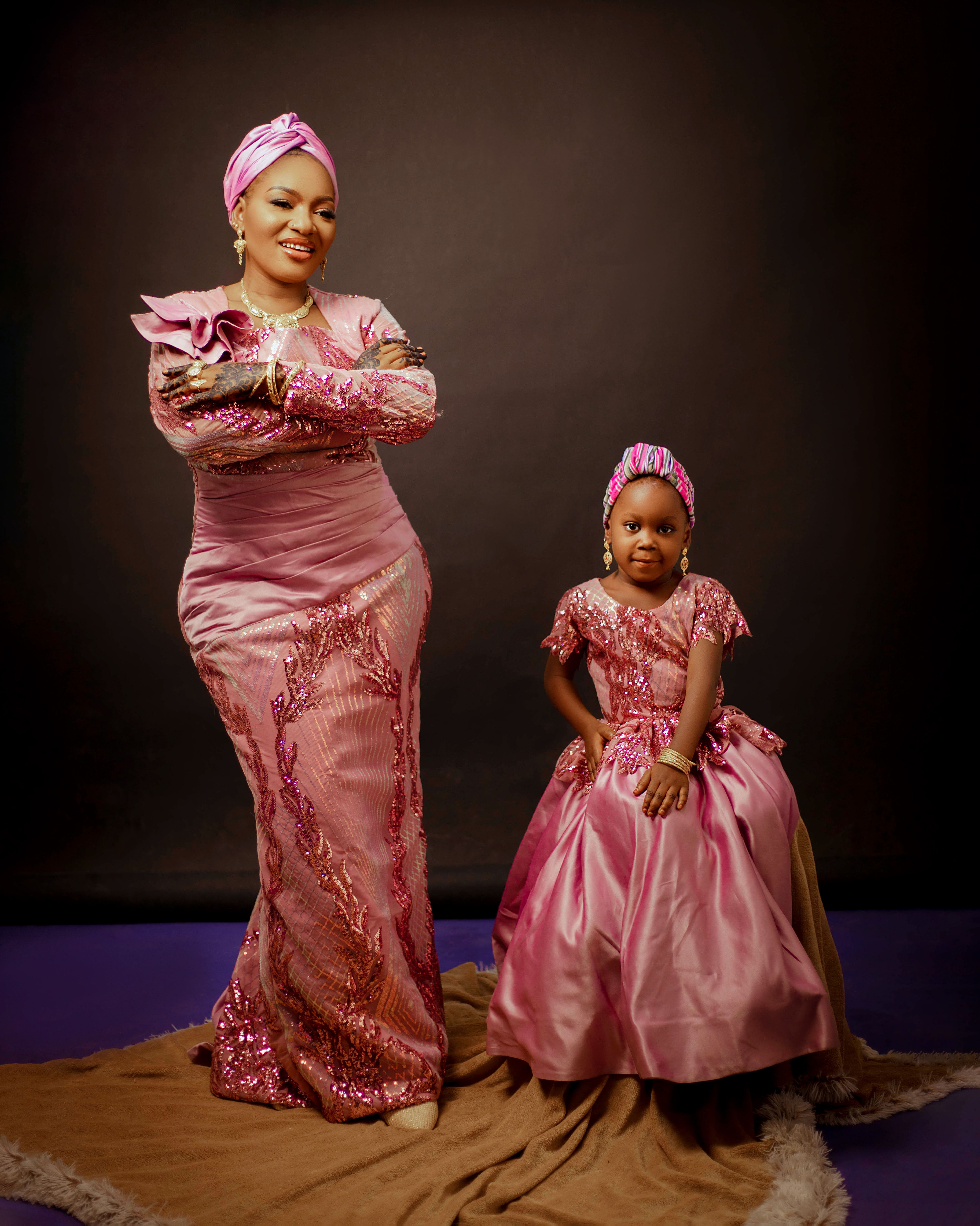 Elegant Portrait of Mother and Daughter in Matching Pink Dresses  Free  Stock Photo