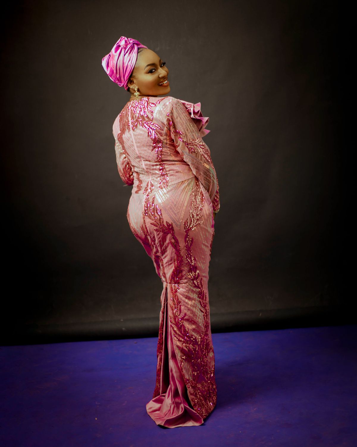 Elegant Woman in Traditional Pink Attire · Free Stock Photo