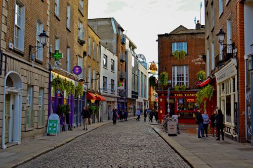 Free Explore Dublin's vibrant Temple Bar district, a popular tourist hub with charming architecture and cobblestone streets. Stock Photo