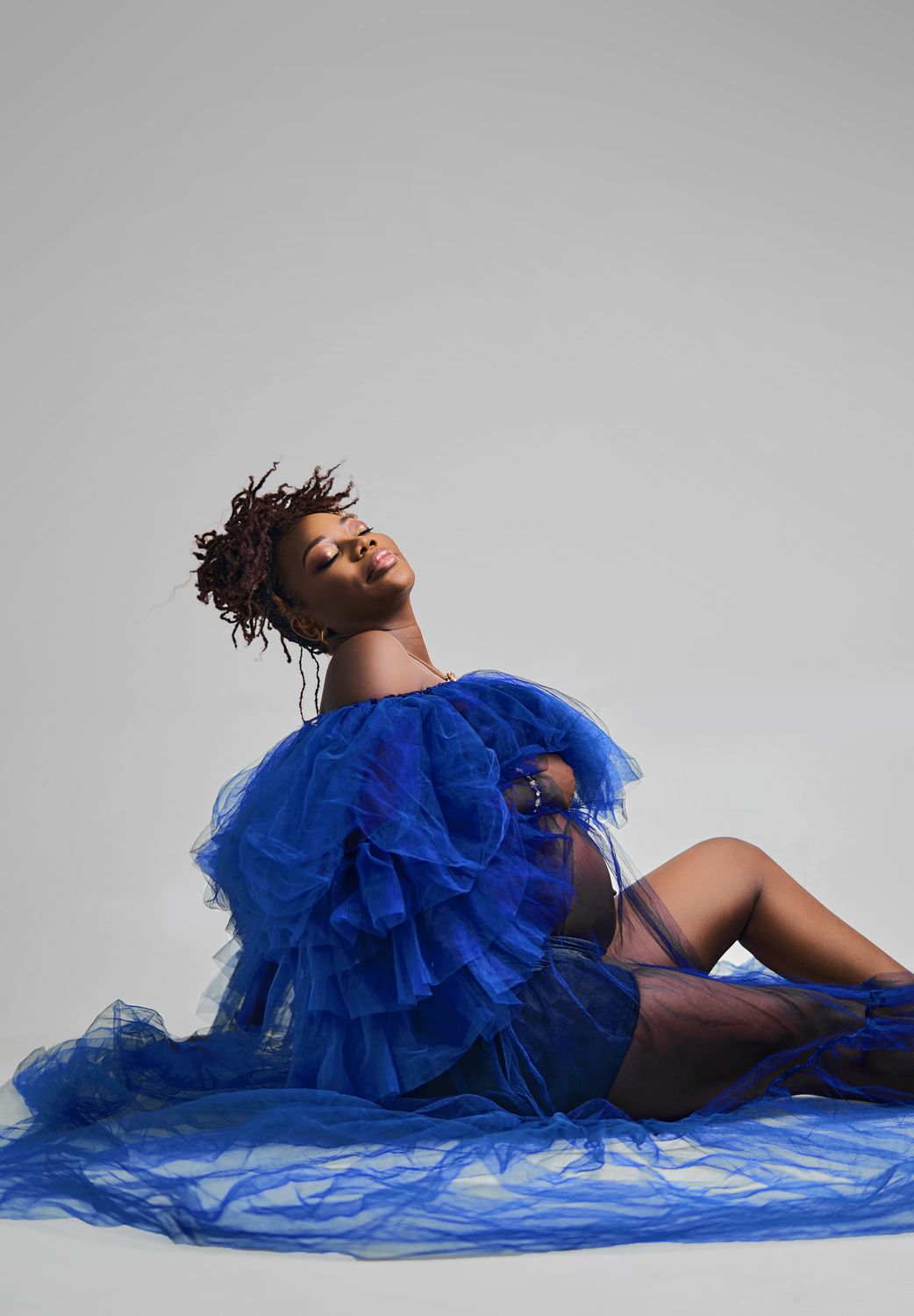 Elegant Woman in Blue Gown with Captivating Pose · Free Stock Photo
