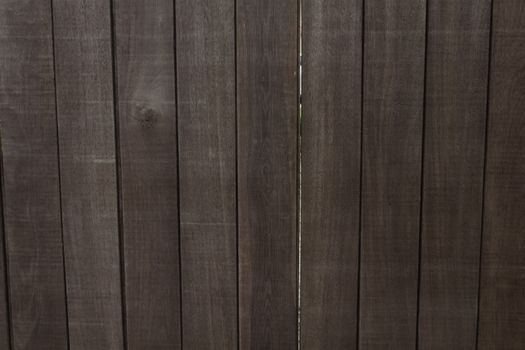 Rustic wooden fence panels creating a natural and textured backdrop, photographed in Medellín, Antioquia.