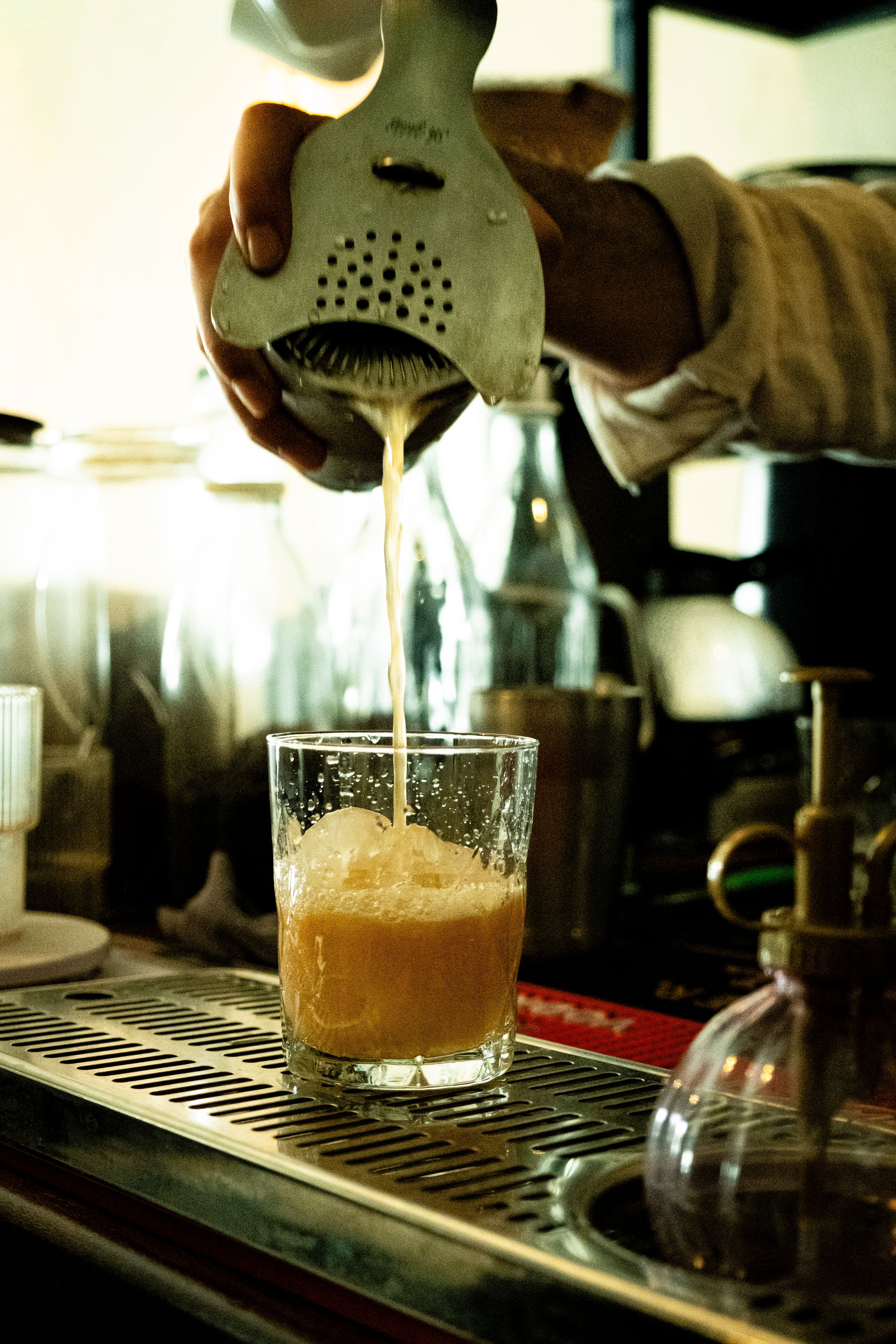 Craft Cocktail Preparation in Cozy Bar Setting · Free Stock Photo