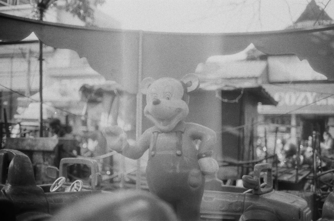 black and white image of a vintage amusement park featuring a classic