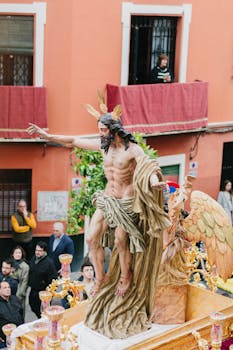 A detailed view of a religious float during the Semana Santa procession in Seville, Spain.
