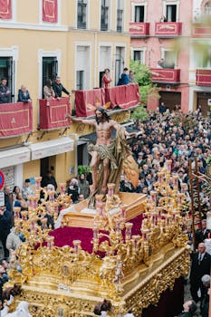 Vibrant Holy Week procession with a religious float in the streets of Seville.