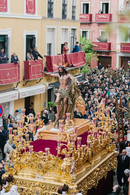 Free Vibrant Holy Week procession with a religious float in the streets of Seville. Stock Photo