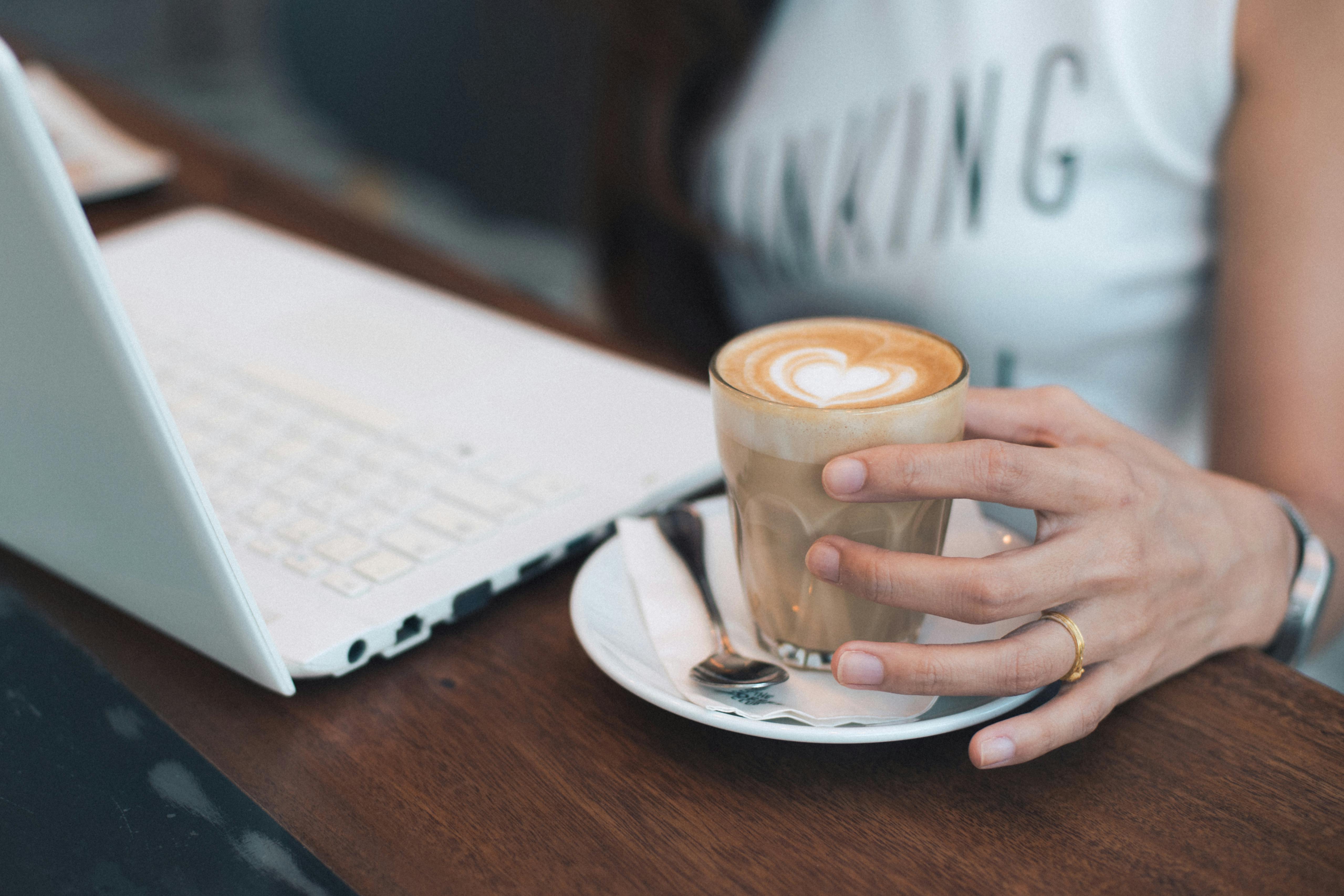 Woman Holding Coffee Cup · Free Stock Photo