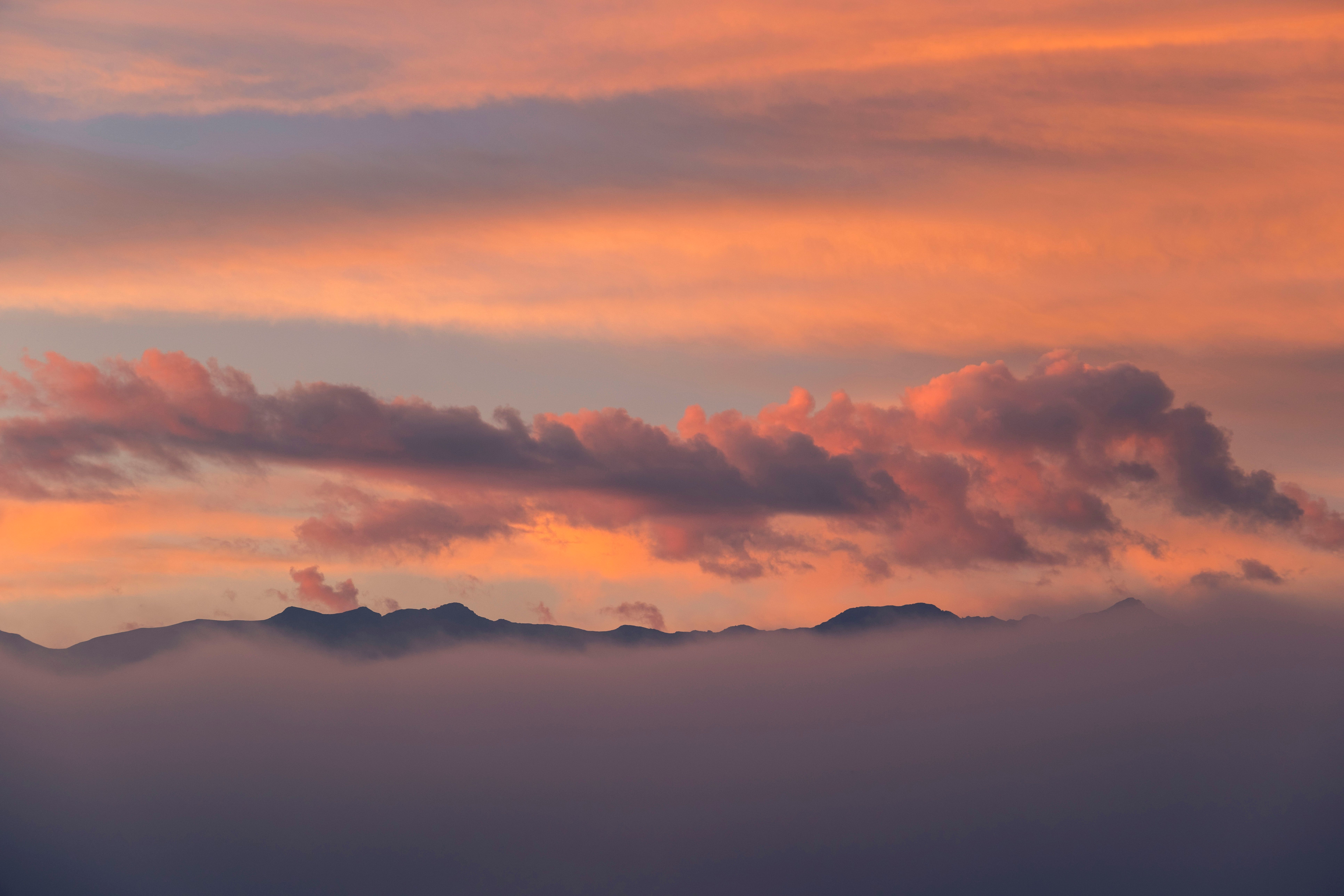 Enchanting Sunset Over Misty Mountains · Free Stock Photo