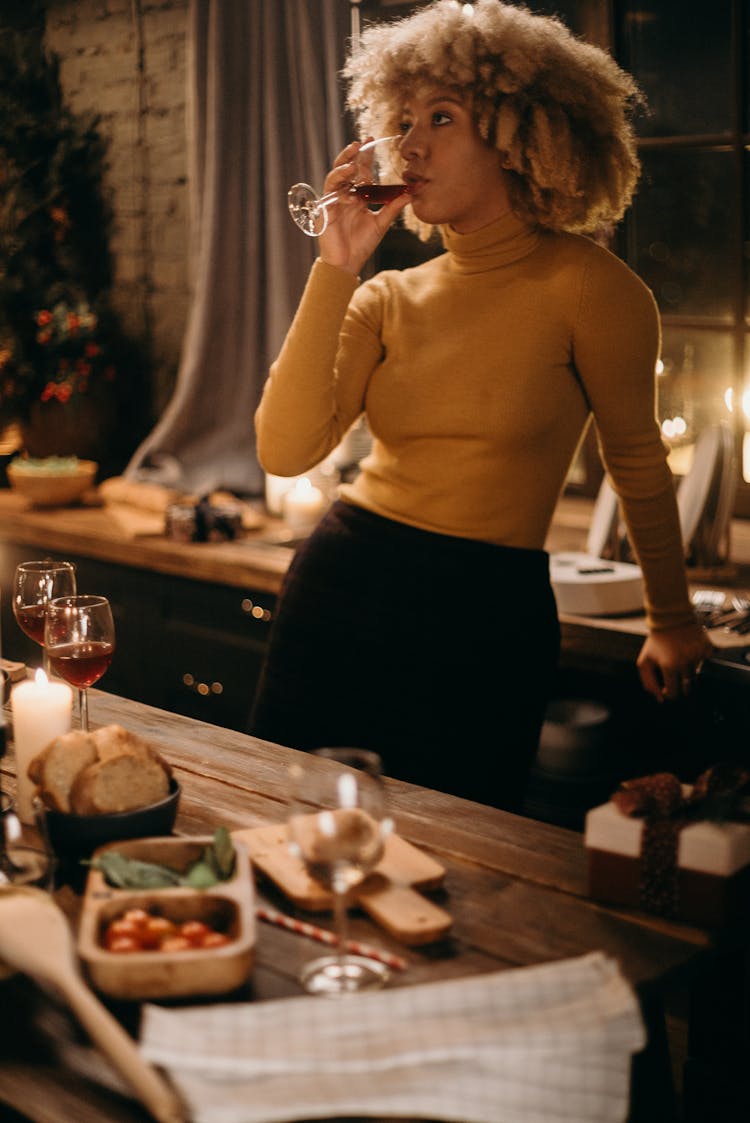 Selective Focus Photography Of Standing Woman Drinking Wine